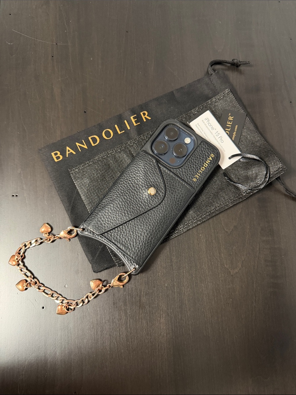 Bandolier Black Pebbled Leather iPhone 15 Pro Case with Heart Chain